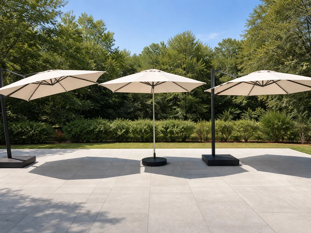 Three opened patio umbrellas side-by-side showing cantilever, center-pole, and offset pole placements and shade clearanc