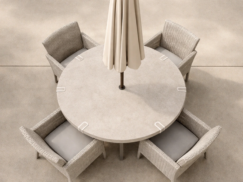 Top-down view of a round outdoor table with a canopy above, showing clearances between table and umbrella.