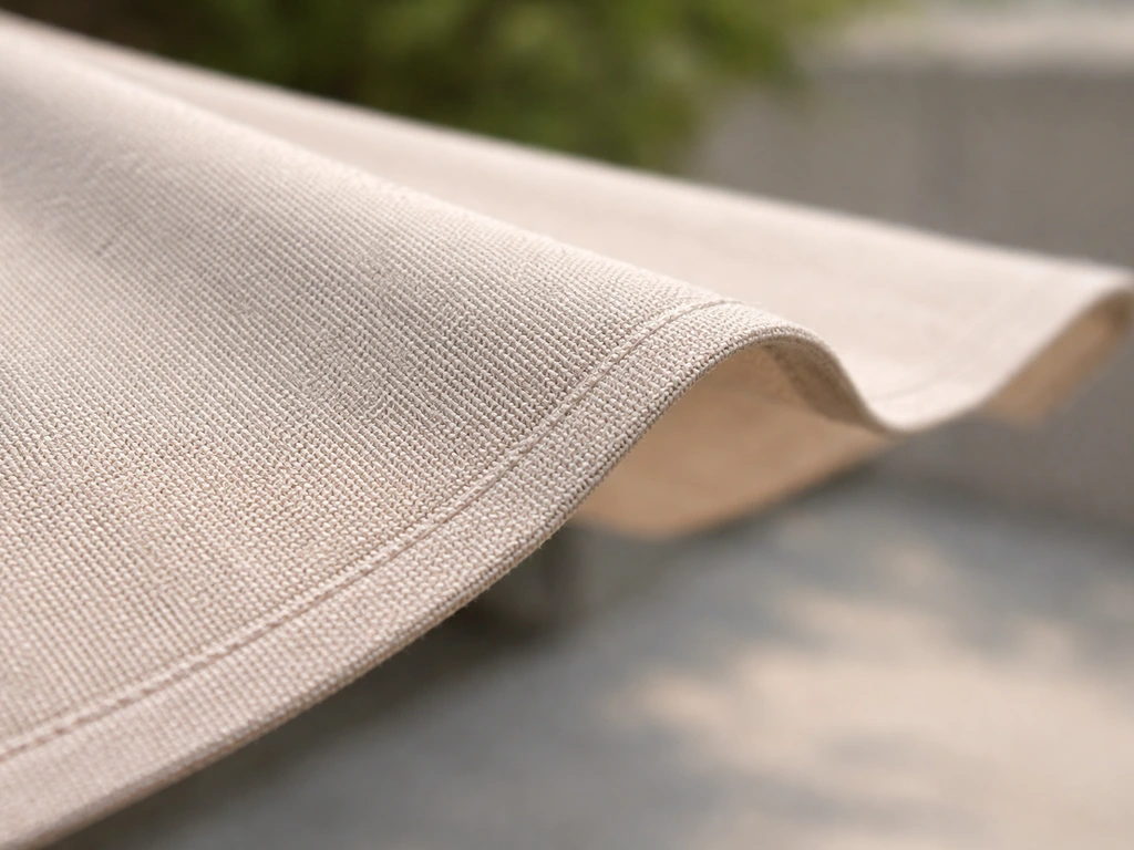 Close-up of solution-dyed acrylic canopy fabric texture with clear weave and outdoor-ready detail.